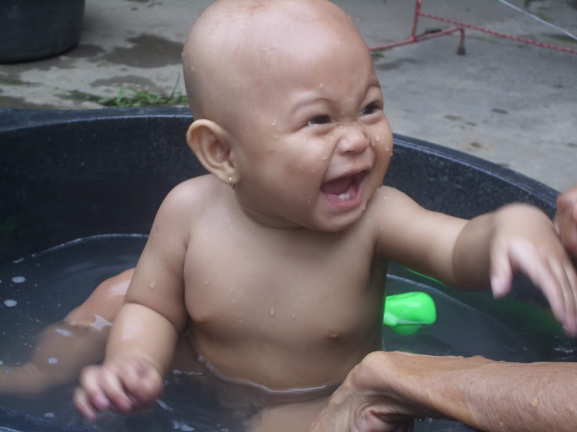 child,wet,people,bath,swimming,dug-out pool,portrait,baby