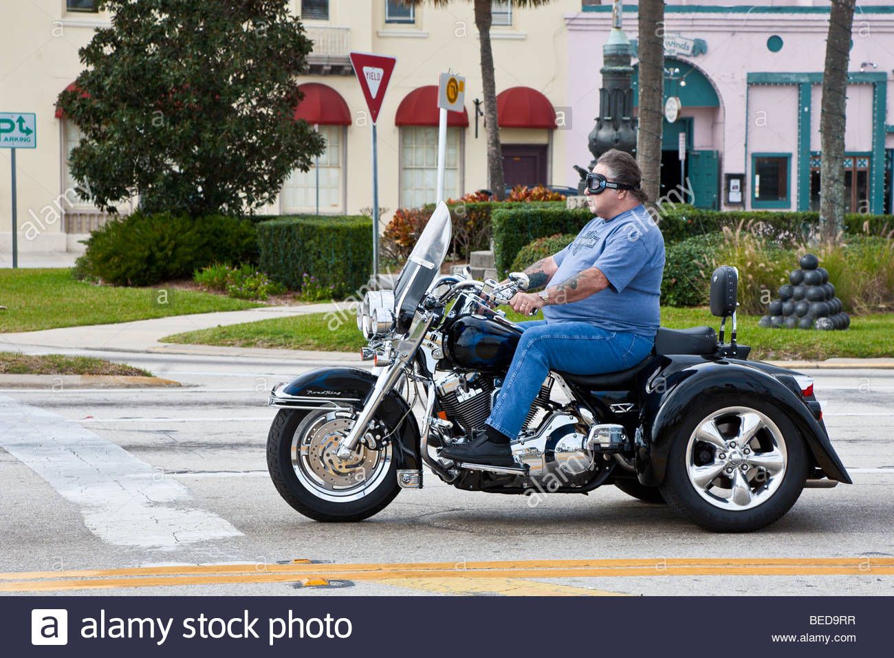 overweight-man-riding-three-wheeled-moto