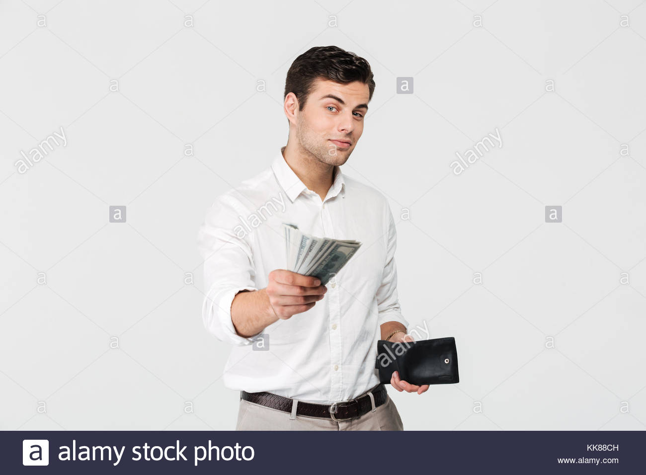 portrait-of-a-successful-smiling-man-holding-wallet-and-giving-money-KK88CH.jpg