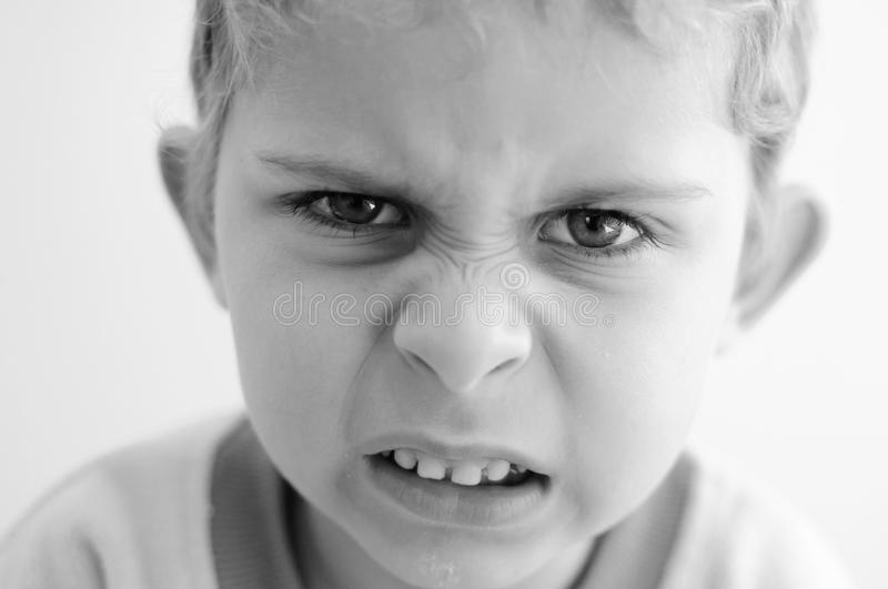 angry-little-boy-looks-straight-to-camer