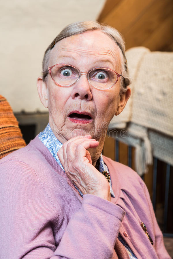 surprised-old-woman-matron-looking-camera-58228525.jpg