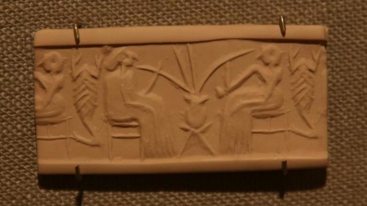 A clay seal depicting beer drinking in a banquet scene dating from 2600-2350 B.C. (Credit: E. Jason Wambsgans/Getty Images)