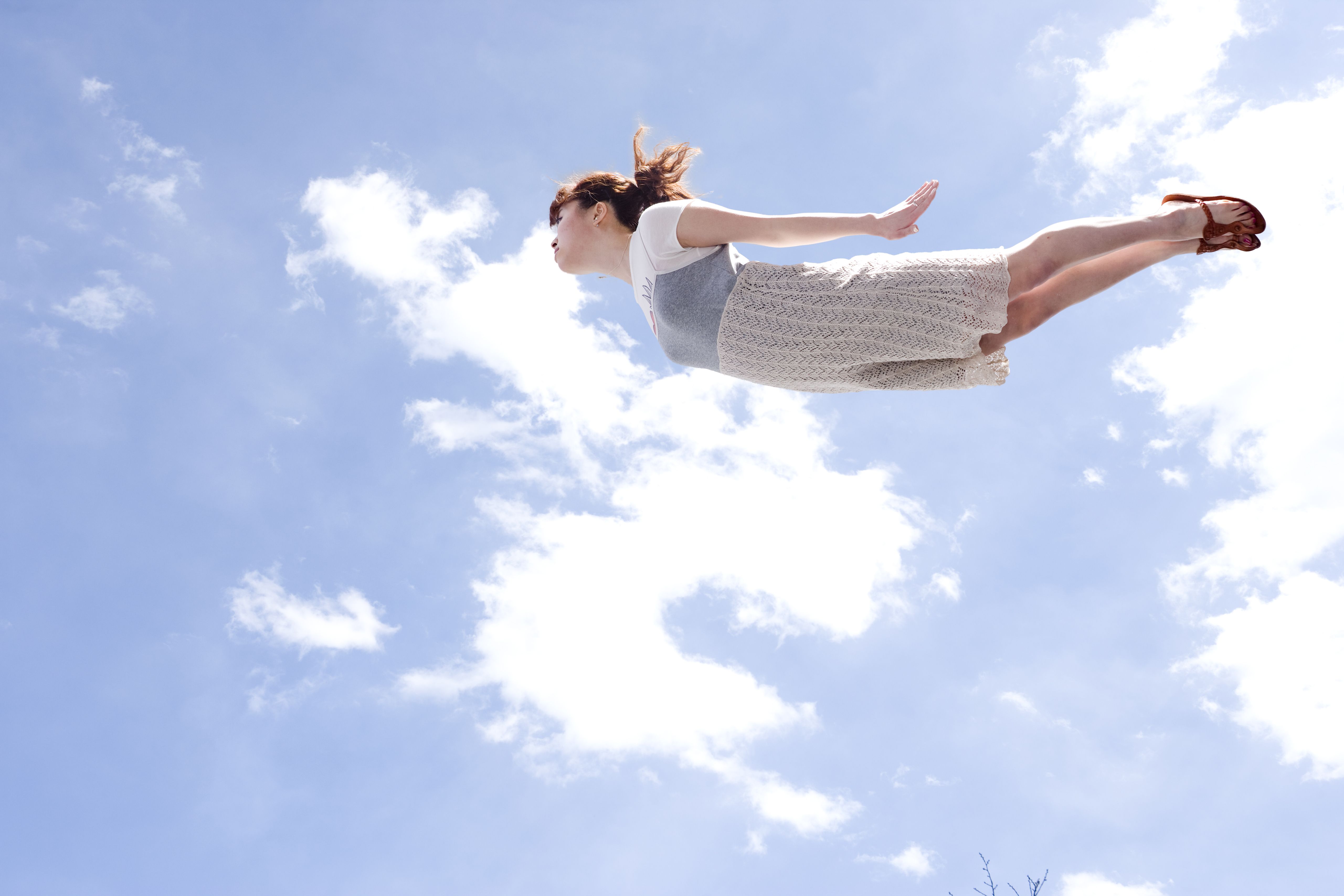young-woman-flying-in-sky-low-angle-view-high-res-stock-photography-88972142-1551831652.jpg?crop=1xw:0.9999xh;center,top%26resize=480:*&f=1&nofb=1&ipt=e0febe39f013917f284215f32c6d74fc46ffc4710d3152268f91abb50ace4b07&ipo=images