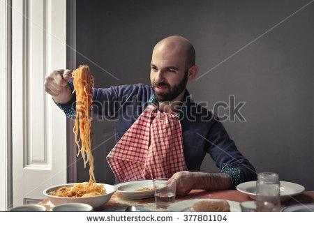 Greedy man eating pasta