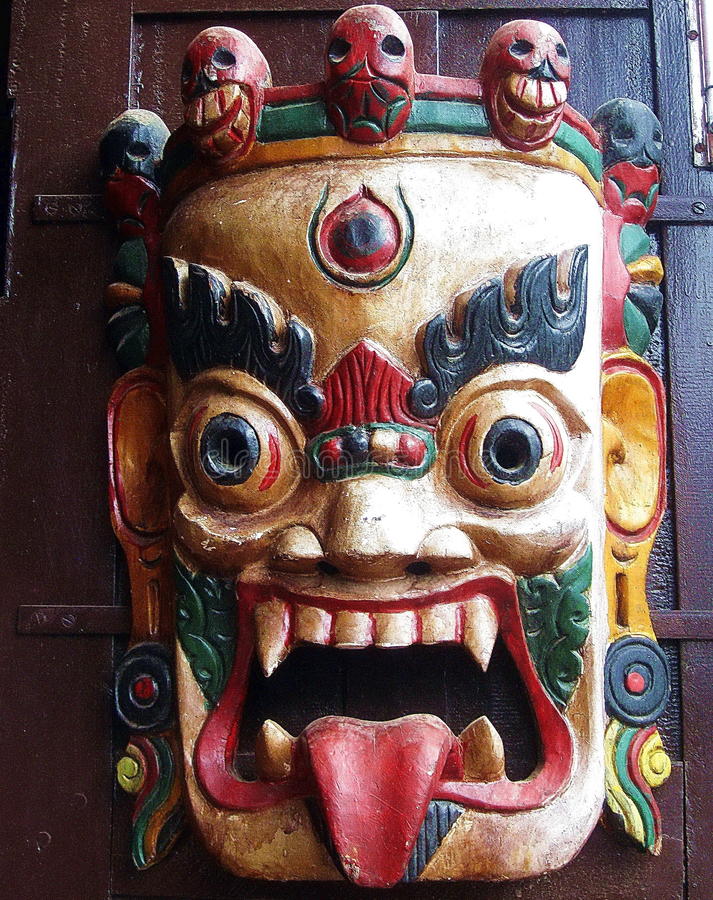 tibetan-buddhist-wrathful-deity-mask-display-outside-cafe-boudhanath-kathmandu-nepal-58804463.jpg