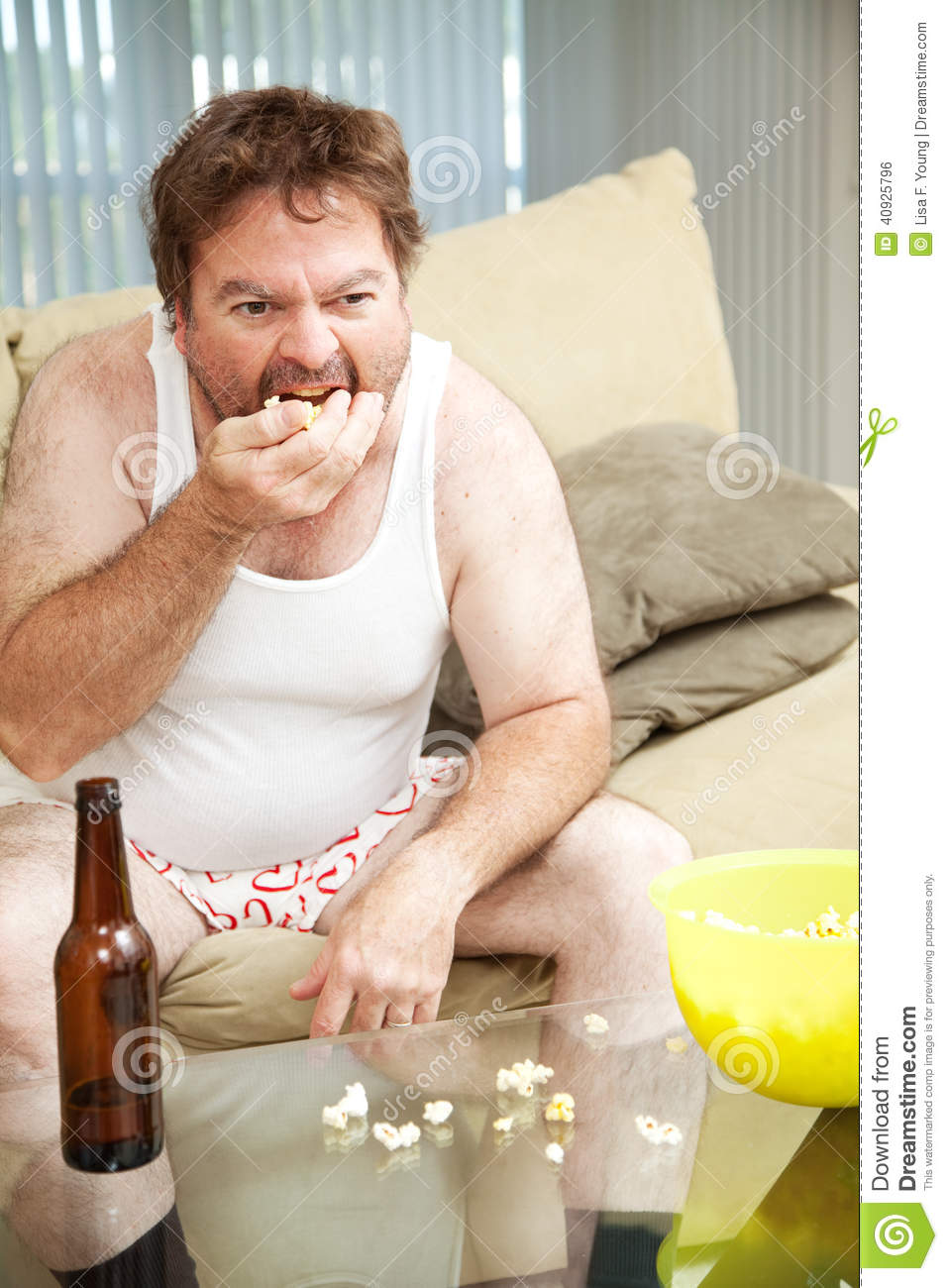 couch-potato-eats-popcorn-middle-aged-man-home-watching-tv-drinking-beer-eating-his-underwear-40925796.jpg