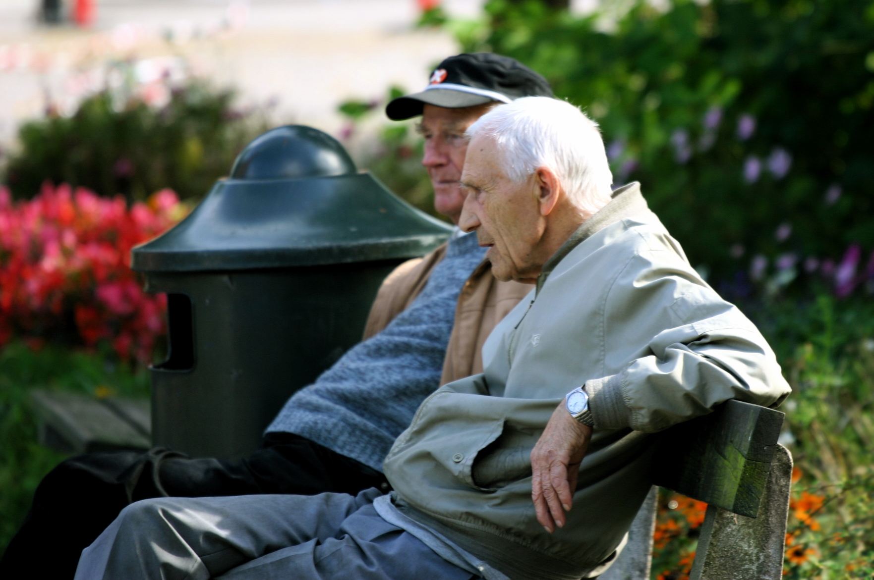 Two_old_men_sitting_on_a_bench_(36543268