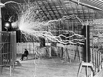 330px-Nikola_Tesla,_with_his_equipment_W